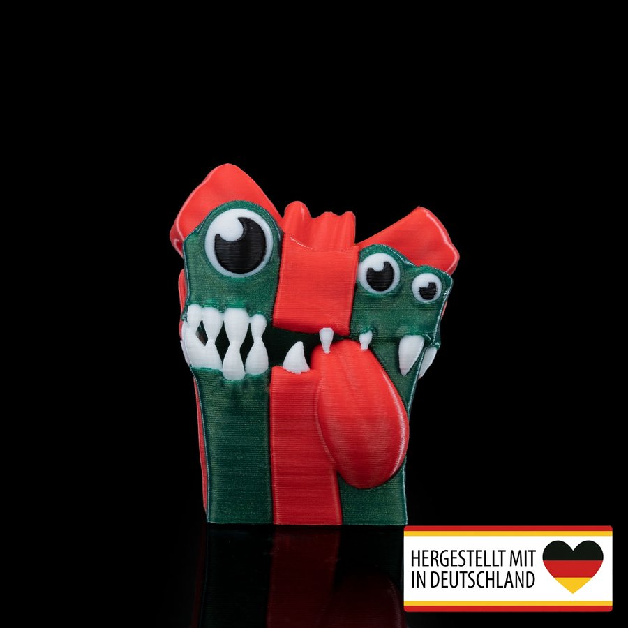 Weihnachtsbaumschmuck in Form eines bissigen Geschenks als festlicher Hingucker